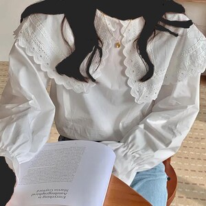 بلوزة الفراشة البيضاء